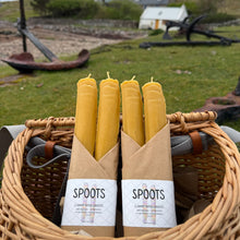 Load image into Gallery viewer, Basket with beeswax candles and packaging on a grassy outdoor background